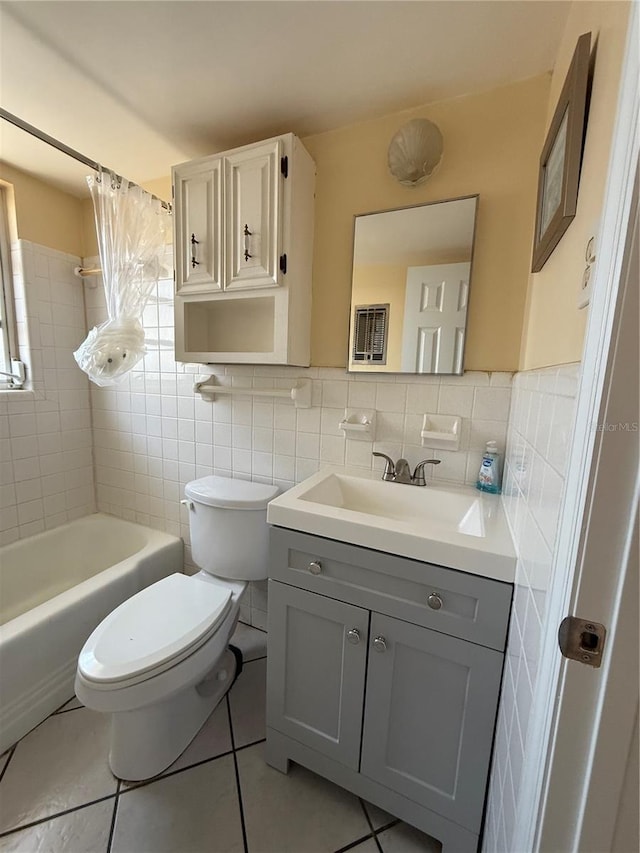 6006 Midnight Pass Rd Unit 48, Sarasota, FL 34242 - full bathroom featuring tile walls, vanity, toilet, tile patterned flooring, and shower / tub combo