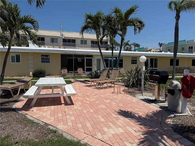6006 Midnight Pass Rd Unit 48, Sarasota, FL 34242 - rear view of property featuring a patio and stucco siding