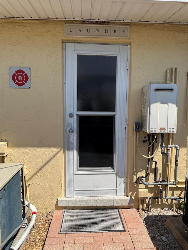 6006 Midnight Pass Rd Unit 48, Sarasota, FL 34242 - property entrance featuring stucco siding