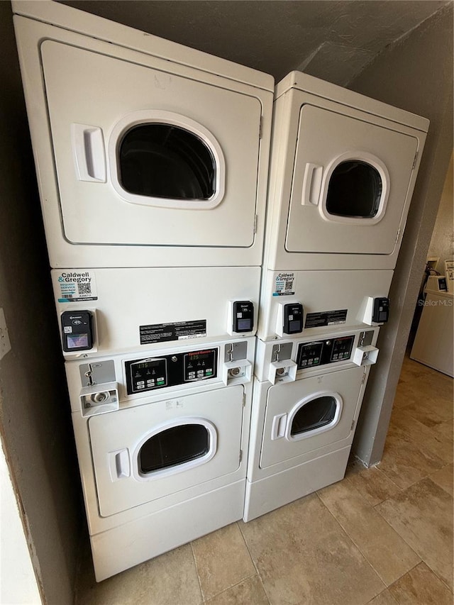 6006 Midnight Pass Rd Unit 48, Sarasota, FL 34242 - community laundry featuring stacked washing machine and dryer and washer and dryer