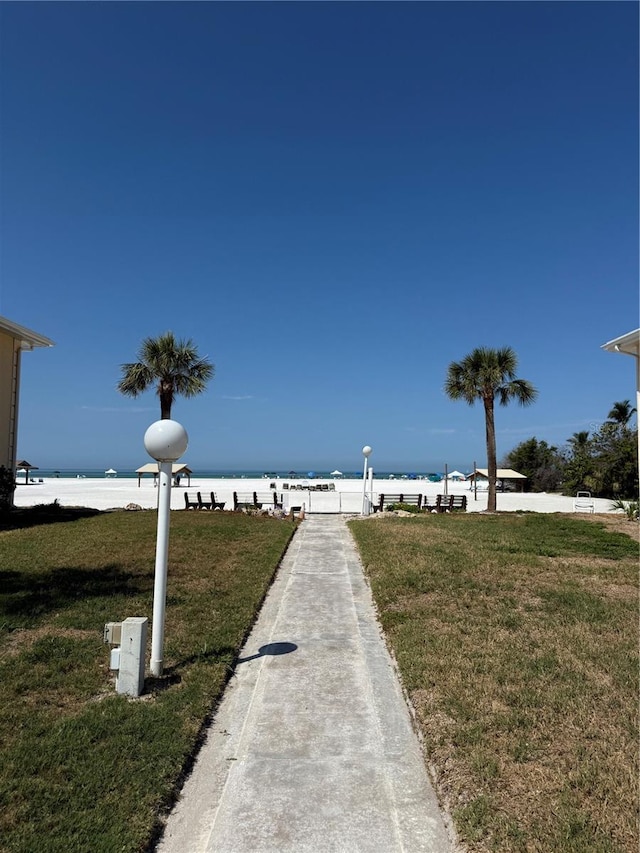 6006 Midnight Pass Rd Unit 48, Sarasota, FL 34242 - view of green lawn featuring a water view