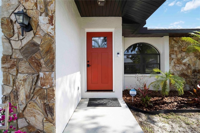 2477 Wood Oak Dr, Sarasota, FL 34232 - property entrance with stone siding and stucco siding