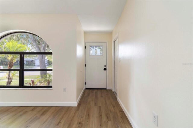 2477 Wood Oak Dr, Sarasota, FL 34232 - foyer with wood finished floors and baseboards