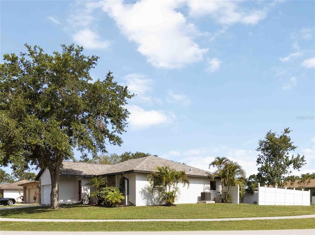 2477 Wood Oak Dr, Sarasota, FL 34232 - single story home with an attached garage and stucco siding