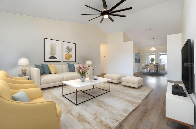 2477 Wood Oak Dr, Sarasota, FL 34232 - living area with ceiling fan, high vaulted ceiling, and wood finished floors