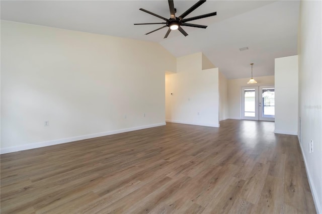 2477 Wood Oak Dr, Sarasota, FL 34232 - unfurnished living room with ceiling fan, high vaulted ceiling, baseboards, light wood-type flooring, and french doors