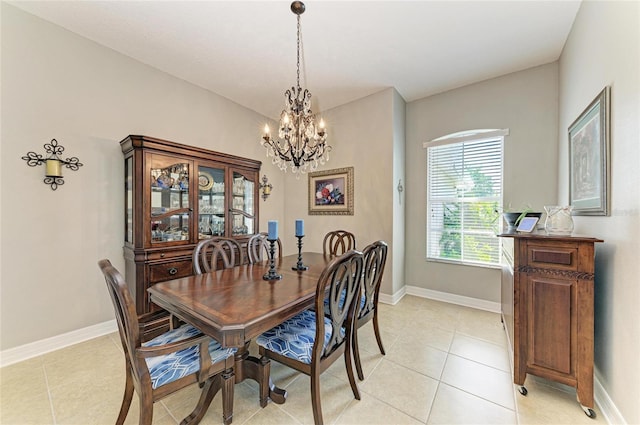 5319 120th Ave E, Parrish, FL 34219 - dining area with a chandelier, light tile patterned flooring, and baseboards