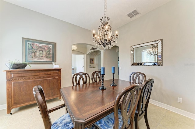 5319 120th Ave E, Parrish, FL 34219 - dining area featuring arched walkways, light tile patterned floors, baseboards, and a chandelier