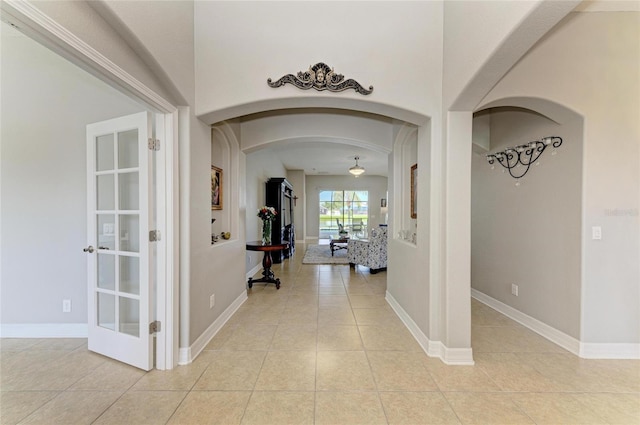 5319 120th Ave E, Parrish, FL 34219 - corridor featuring arched walkways and light tile patterned flooring