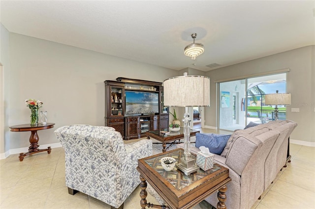 5319 120th Ave E, Parrish, FL 34219 - living room with baseboards and light tile patterned floors