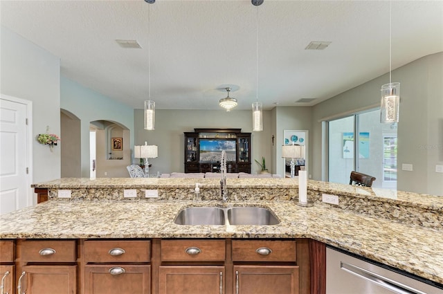 5319 120th Ave E, Parrish, FL 34219 - kitchen with a sink, dishwasher, and brown cabinets
