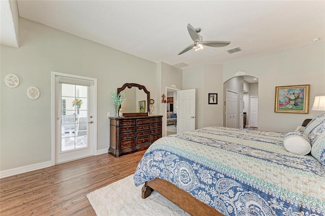 5319 120th Ave E, Parrish, FL 34219 - bedroom featuring wood finished floors, arched walkways, baseboards, and ceiling fan