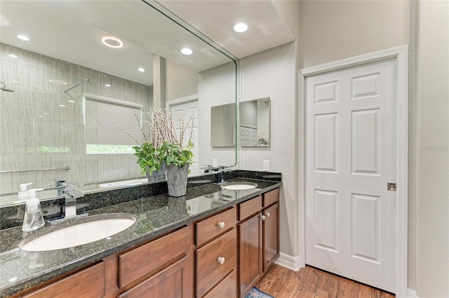 5319 120th Ave E, Parrish, FL 34219 - full bathroom with double vanity, a garden tub, wood finished floors, tiled shower, and recessed lighting