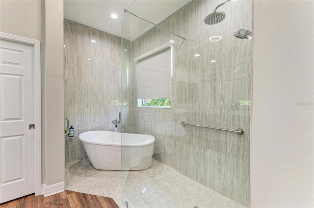5319 120th Ave E, Parrish, FL 34219 - bathroom featuring walk in shower and a freestanding tub