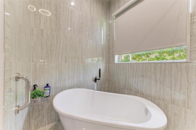 5319 120th Ave E, Parrish, FL 34219 - bathroom with tile walls and a freestanding tub