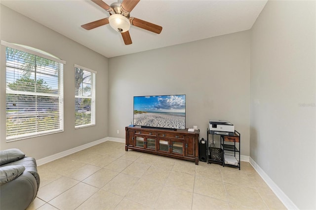 5319 120th Ave E, Parrish, FL 34219 - living room with light tile patterned floors, a ceiling fan, and baseboards