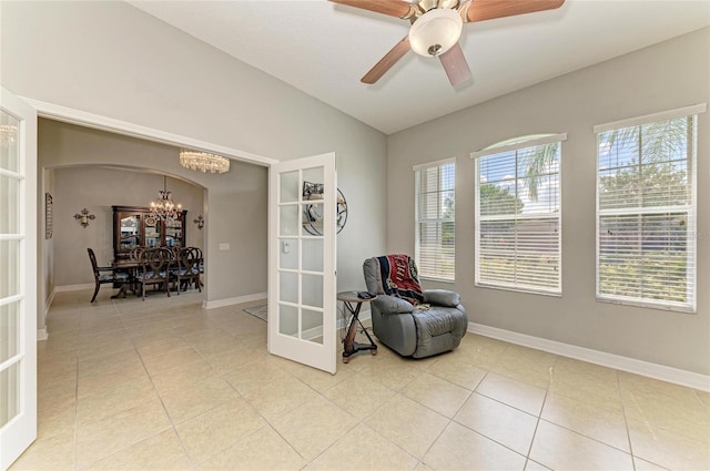 5319 120th Ave E, Parrish, FL 34219 - sitting room with a chandelier, french doors, light tile patterned floors, lofted ceiling, and baseboards