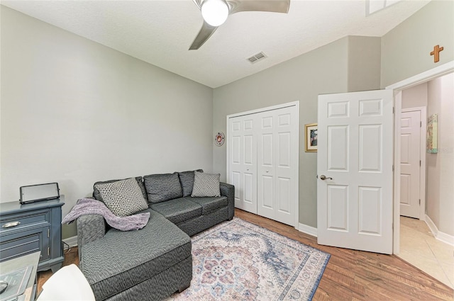 5319 120th Ave E, Parrish, FL 34219 - living room featuring a ceiling fan, wood finished floors, and baseboards