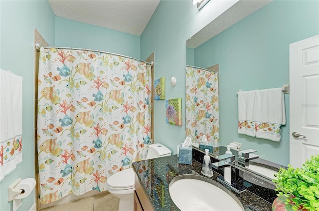5319 120th Ave E, Parrish, FL 34219 - full bathroom featuring vanity, toilet, tile patterned floors, curtained shower, and a textured ceiling