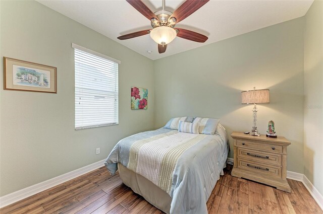 5319 120th Ave E, Parrish, FL 34219 - bedroom with baseboards, hardwood / wood-style floors, and ceiling fan
