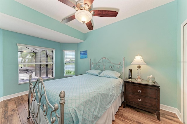 5319 120th Ave E, Parrish, FL 34219 - bedroom featuring baseboards, wood finished floors, and ceiling fan