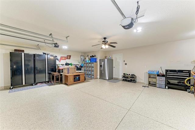5319 120th Ave E, Parrish, FL 34219 - garage featuring stainless steel fridge and a garage door opener
