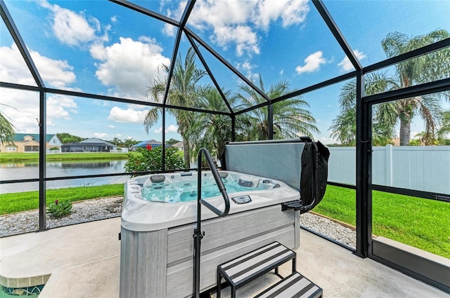 5319 120th Ave E, Parrish, FL 34219 - sunroom / solarium featuring a hot tub, a water view, and healthy amount of natural light