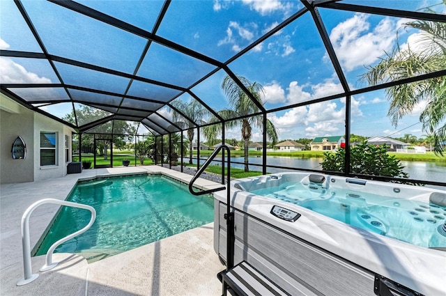 5319 120th Ave E, Parrish, FL 34219 - swimming pool featuring a water view, a patio area, a hot tub, and a lanai