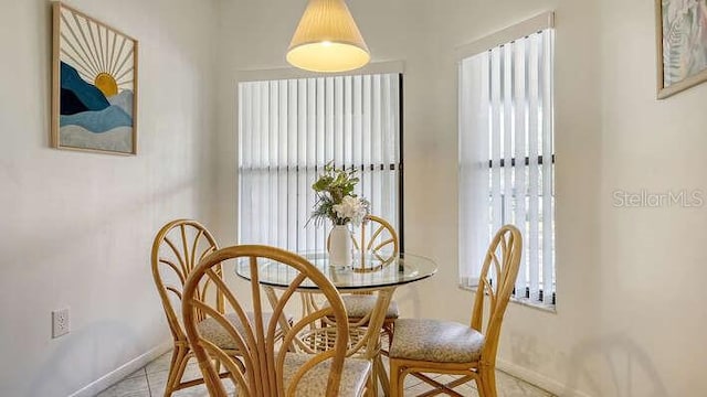4325 46th Ave W Unit 203, Bradenton, FL 34210 - dining area with baseboards and light tile patterned floors