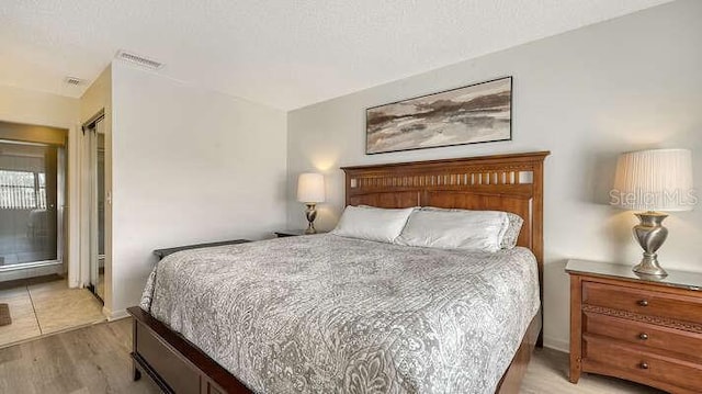 4325 46th Ave W Unit 203, Bradenton, FL 34210 - bedroom with light wood finished floors and baseboards