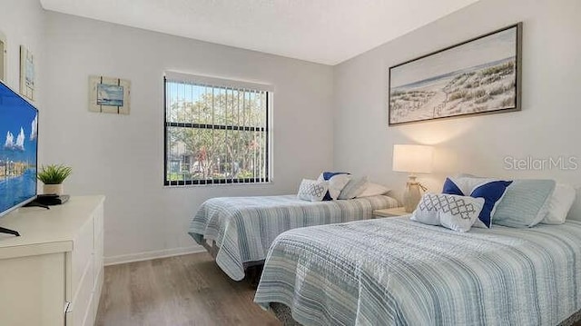 4325 46th Ave W Unit 203, Bradenton, FL 34210 - bedroom with wood finished floors and baseboards