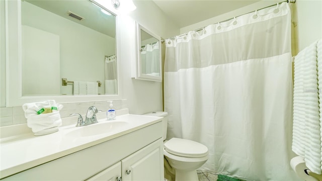 4325 46th Ave W Unit 203, Bradenton, FL 34210 - bathroom featuring toilet, vanity, tasteful backsplash, and a shower with shower curtain