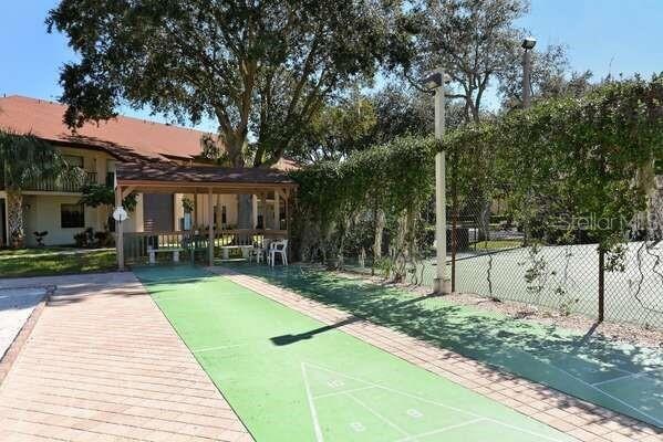 4325 46th Ave W Unit 203, Bradenton, FL 34210 - view of home's community with shuffleboard