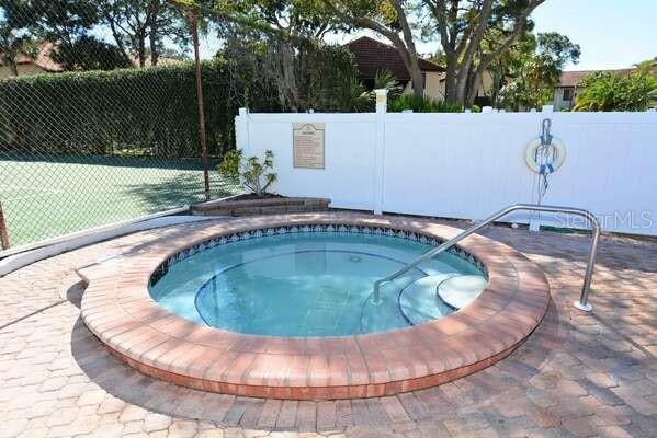 4325 46th Ave W Unit 203, Bradenton, FL 34210 - view of swimming pool featuring a swimming pool and a hot tub