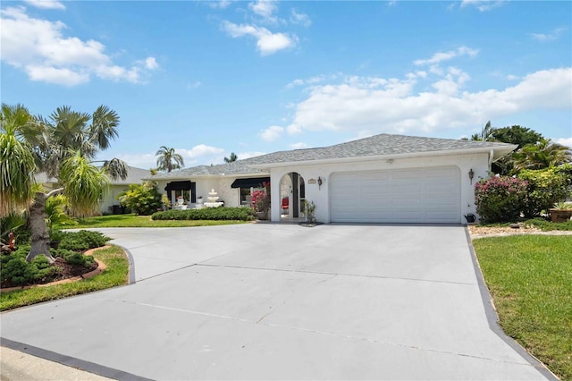 965 E Gondola Dr, Venice, FL 34293 - ranch-style house featuring concrete driveway, stucco siding, an attached garage, and a front yard