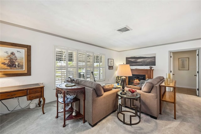 965 E Gondola Dr, Venice, FL 34293 - living room with light colored carpet, a glass covered fireplace, and ornamental molding