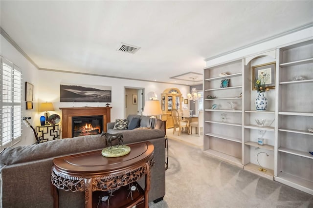 965 E Gondola Dr, Venice, FL 34293 - living area with carpet, a glass covered fireplace, a chandelier, and crown molding