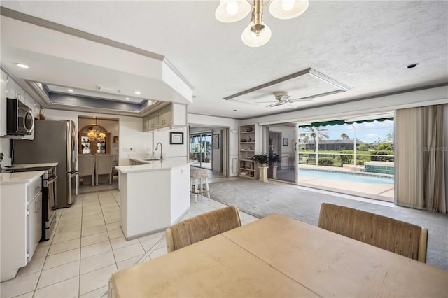 965 E Gondola Dr, Venice, FL 34293 - dining space featuring light tile patterned floors, a ceiling fan, arched walkways, and recessed lighting