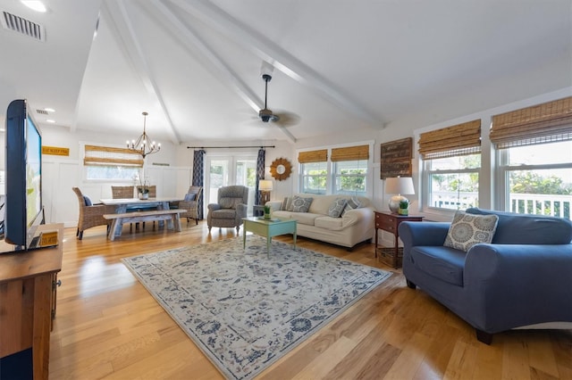 221 85th St, Holmes Beach, FL 34217 - living room featuring a chandelier, ceiling fan, light wood finished floors, and recessed lighting
