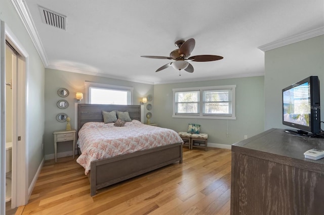 221 85th St, Holmes Beach, FL 34217 - bedroom with light wood finished floors, ornamental molding, baseboards, and a ceiling fan