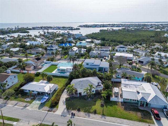 221 85th St, Holmes Beach, FL 34217 - aerial perspective of suburban area with a nearby body of water