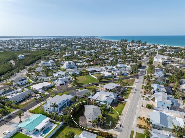 221 85th St, Holmes Beach, FL 34217 - aerial overview of property's location featuring a large body of water and nearby suburban area