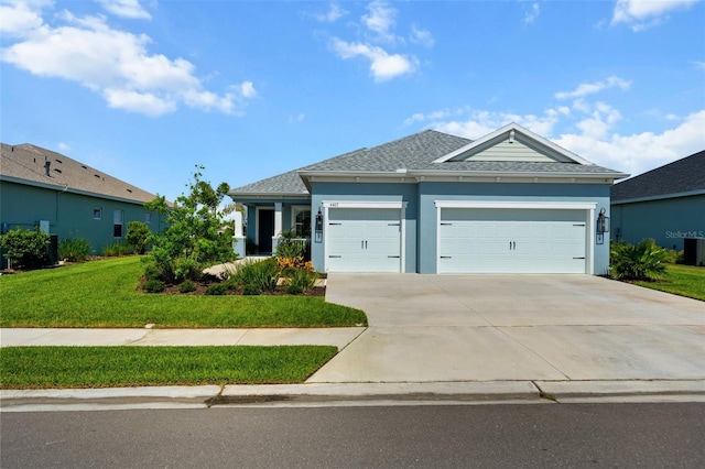 4407 Big Woods Way, Parrish, FL 34219 - ranch-style home featuring a garage, driveway, a front yard, a shingled roof, and stucco siding