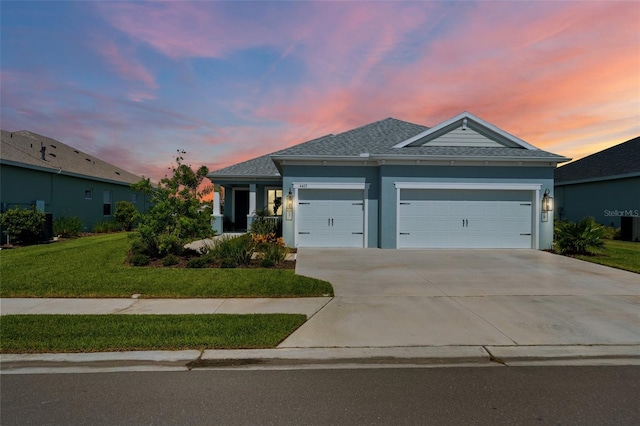 4407 Big Woods Way, Parrish, FL 34219 - ranch-style home featuring an attached garage, driveway, a front yard, a shingled roof, and stucco siding