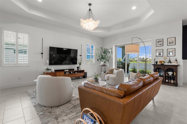 4407 Big Woods Way, Parrish, FL 34219 - living area featuring a raised ceiling, a chandelier, light tile patterned floors, recessed lighting, and baseboards