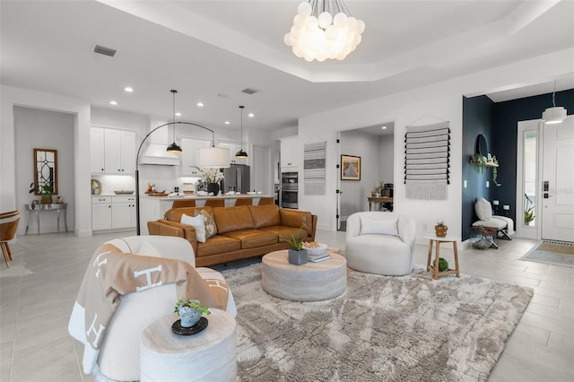 4407 Big Woods Way, Parrish, FL 34219 - living room featuring a chandelier, recessed lighting, and light tile patterned flooring