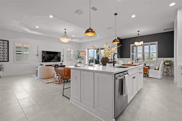 4407 Big Woods Way, Parrish, FL 34219 - kitchen featuring stainless steel dishwasher, a sink, a chandelier, open floor plan, and light countertops