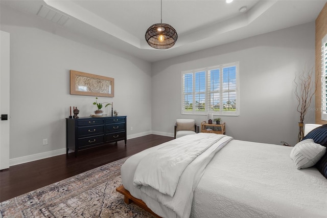 4407 Big Woods Way, Parrish, FL 34219 - bedroom featuring wood finished floors, baseboards, and a raised ceiling