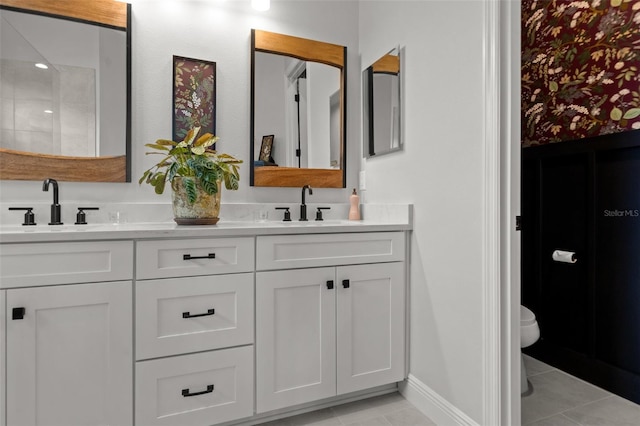4407 Big Woods Way, Parrish, FL 34219 - full bathroom featuring double vanity, toilet, tile patterned flooring, and baseboards