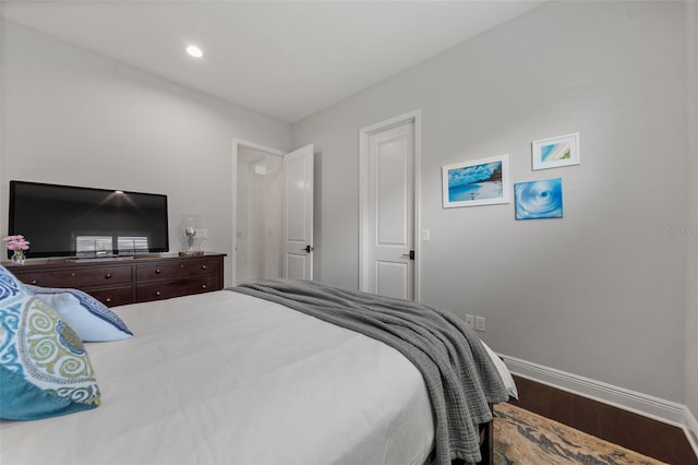 4407 Big Woods Way, Parrish, FL 34219 - bedroom with wood finished floors and baseboards